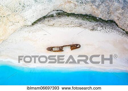 Beach with shipwreck, drone shot, Navagio Beach, Zakynthos, Greece, Europe View Large Photo Image Stock Image - Beach with shipwreck, drone shot, Navagio Beach, Zakynthos, Greece, Europe. Fotosearch