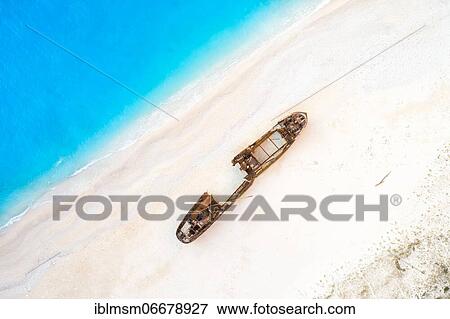 Beach with shipwreck, drone shot, Navagio Beach, Zakynthos Island, Greece, Europe View Large Photo Image Stock Photo - Beach with shipwreck, drone shot, Navagio Beach, Zakynthos Island, Greece, Europe. Fotosearch