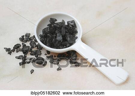 Stock Image - Black Hawaiian salt, lava salt, sea salt with activated carbon, salt, table salt, gourmet salt. Fotosearch