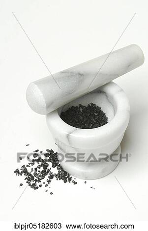 Stock Image - Black Hawaiian salt, lava salt, sea salt with activated carbon, salt, table salt, gourmet salt, mortar. Fotosearch