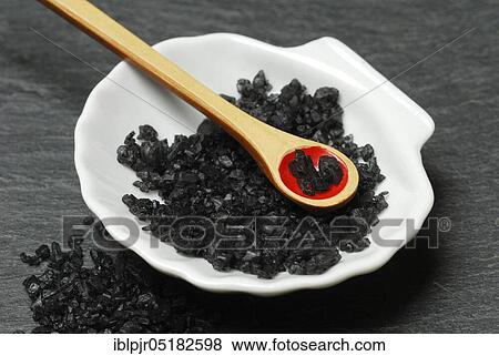 Stock Photo - Black Hawaiian salt, lava salt, sea salt with activated carbon, salt, table salt, gourmet salt. Fotosearch