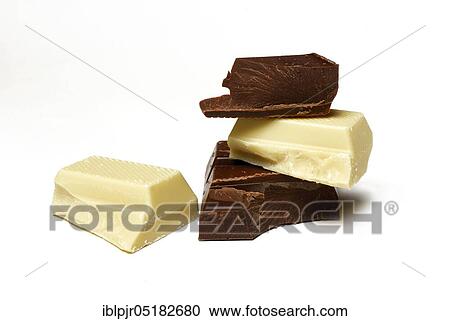 Stock Image - Block chocolate in pieces, chocolate, milk chocolate, milk chocolate, cake glaze, couverture. Fotosearch