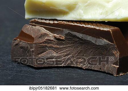 Block chocolate in pieces, chocolate, milk chocolate, milk chocolate, cake glaze, couverture View Large Photo Image Stock Image - Block chocolate in pieces, chocolate, milk chocolate, milk chocolate, cake glaze, couverture. Fotosearch