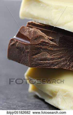 Block chocolate in pieces, chocolate, milk chocolate, milk chocolate, cake glaze, couverture View Large Photo Image Stock Image - Block chocolate in pieces, chocolate, milk chocolate, milk chocolate, cake glaze, couverture. Fotosearch
