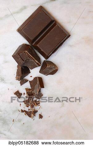 Block chocolate in pieces, chocolate, milk chocolate, cake glaze, couverture View Large Photo Image Stock Photo - Block chocolate in pieces, chocolate, milk chocolate, cake glaze, couverture. Fotosearch