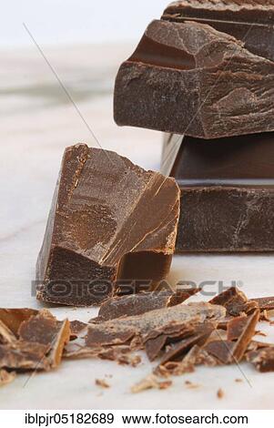 Block chocolate in pieces, chocolate, milk chocolate, cake glaze, couverture View Large Photo Image Stock Photo - Block chocolate in pieces, chocolate, milk chocolate, cake glaze, couverture. Fotosearch