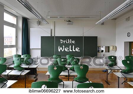 Board with inscription THIRD WAVE, classroom, Corona crisis, Germany, Europe View Large Photo Image Stock Photo - Board with inscription THIRD WAVE, classroom, Corona crisis, Germany, Europe. Fotosearch