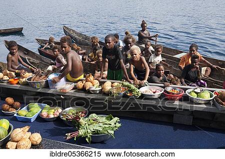 Stock Photography - Boat market, locals selling fruits and vegetables, Florida Islands, Solomon Islands, Oceania. Fotosearch