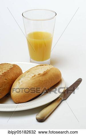 Breakfast, bread roll and orange juice, bread roll, knife View Large Photo Image Stock Image - Breakfast, bread roll and orange juice, bread roll, knife. Fotosearch