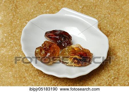 Brown rock candy and brown cane sugar, sweet, sugar crystals, rock candy View Large Photo Image Stock Image - Brown rock candy and brown cane sugar, sweet, sugar crystals, rock candy. Fotosearch