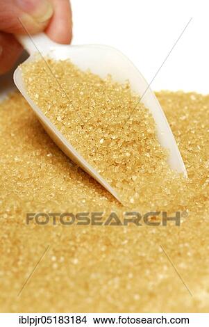 Picture - Brown sugar, beet sugar, cane sugar, sweet, sugar crystals, scoop. Fotosearch