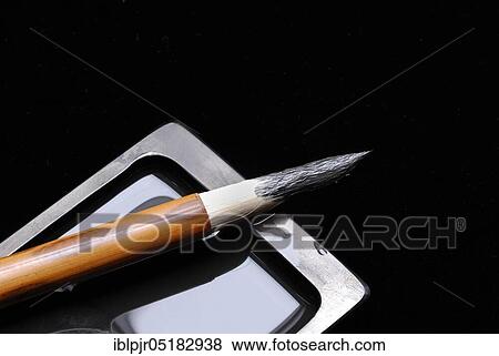 Stock Photo - Brush and rubbing stone, calligraphy, calligraphy brush, calligraphy brush, ink, inkstone, penmanship, ink brush. Fotosearch