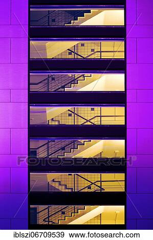 Stock Photo - Business center, illuminated staircase of the in-house in the evening, Dortmund, Ruhr area, North Rhine-Westphalia, Germany, Europe. Fotosearch