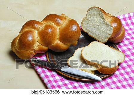 Butter plait on plate, baked goods, Swiss white bread, bread View Large Photo Image Stock Photograph - Butter plait on plate, baked goods, Swiss white bread, bread. Fotosearch