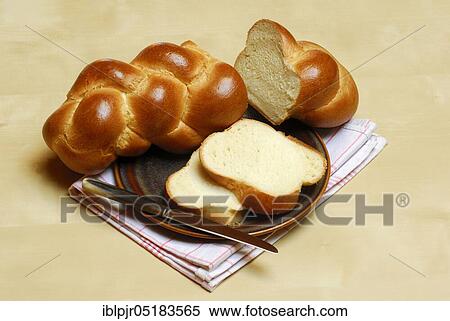 Butter plait on plate, baked goods, Swiss white bread, bread View Large Photo Image Stock Photography - Butter plait on plate, baked goods, Swiss white bread, bread. Fotosearch