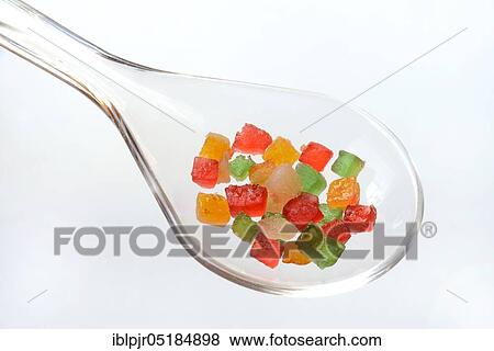 Stock Photo - Candied fruit in ladle, fruit cubes, cubes. Fotosearch