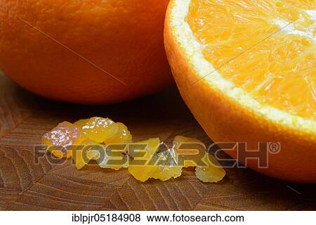 Stock Photo - Candied orange peel, candied orange peel, orange peel cubes and oranges. Fotosearch