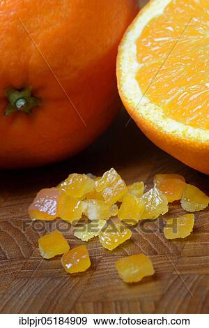 Stock Photo - Candied orange peel, candied orange peel, orange peel cubes and oranges. Fotosearch