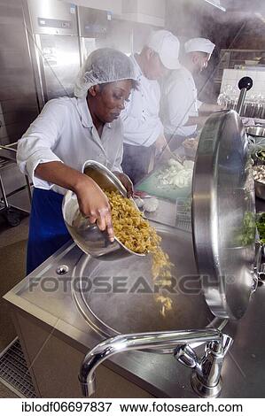 Canteen kitchen of a vocational college in Düsseldorf, trainees manage the catering of the school, practical lessons in the canteen kitchen, trainee pours the noodles into the boiling water, Düsseldorf, Germany, Europe View Large Photo Image Stock Photo - Canteen kitchen of a vocational college in Düsseldorf, trainees manage the catering of the school, practical lessons in the canteen kitchen, trainee pours the noodles into the boiling water, Düsseldorf, Germany, Europe. Fotosearch