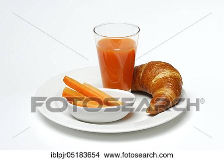 Picture - Carrot juice, carrot juice in glass, carrot sticks and croissant, vegetable juice, carrot, breakfast, carrot juice, carrot juice. Fotosearch