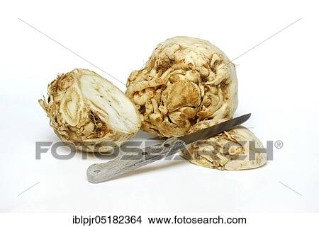 Picture - Celery (Apium graveolens) tuber and halved tuber, knife. Fotosearch