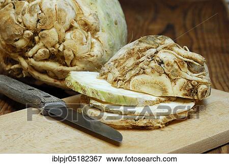 Stock Photo - Celery (Apium graveolens) tubers and s lices, knives. Fotosearch
