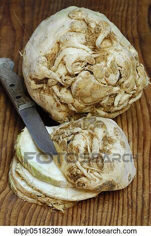 Stock Photo - Celery (Apium graveolens) tubers and s lices, knives. Fotosearch