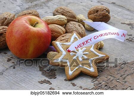 Christmas cookies, walnuts, peanuts and apple View Large Photo Image Picture - Christmas cookies, walnuts, peanuts and apple. Fotosearch
