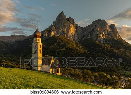 Church San Valentino in the evening light in front of the Schlern, Castelrotto, South Tyrol, Italy, Europe View Large Photo Image Stock Photograph - Church San Valentino in the evening light in front of the Schlern, Castelrotto, South Tyrol, Italy, Europe. Fotosearch