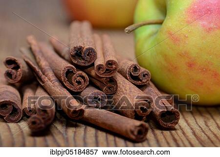 Cinnamon sticks and apple ( Cinnamomum spec. ) View Large Photo Image Stock Photo - Cinnamon sticks and apple ( Cinnamomum spec. ). Fotosearch