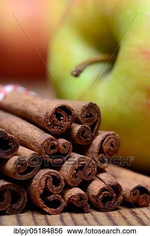 Cinnamon sticks and apple ( Cinnamomum spec. ) View Large Photo Image Stock Photograph - Cinnamon sticks and apple ( Cinnamomum spec. ). Fotosearch