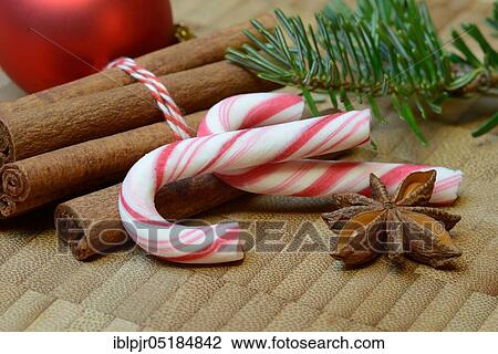 Stock Image - Cinnamonsticks and star anise with Christmas decoration, stick, star anise, aniseed. Fotosearch