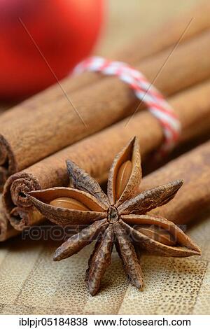 Stock Photo - Cinnamonsticks and star ( Illicium verum) anise with Christmas tree ball, stick, star anise, anise. Fotosearch