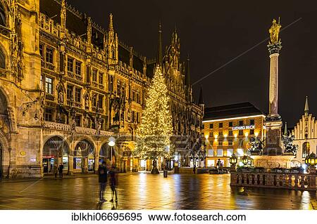 Stock Photography - City hall and Mariensäule at night, in Advent, without Christkindl market because of the Corona pandemic, Marien-Platz, Munich, Upper Bavaria, Bavaria, South Germany. Fotosearch