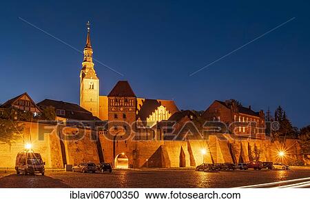 Stock Image - City wall, Elbtor and church St. Stephan, night shot, Tangermünde, Saxony-Anhalt, Germany, Europe. Fotosearch