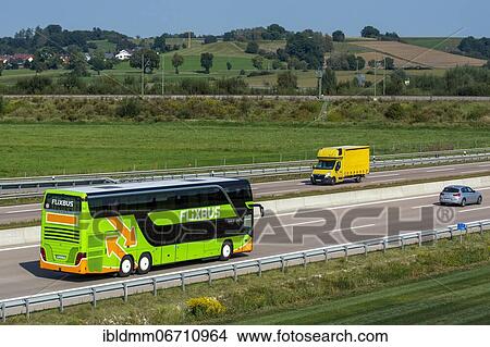 Coach, long-distance bus of the company FlixBus drives on the motorway A8 near Jettingen, Bavaria, Germany, Europe View Large Photo Image Picture - Coach, long-distance bus of the company FlixBus drives on the motorway A8 near Jettingen, Bavaria, Germany, Europe. Fotosearch