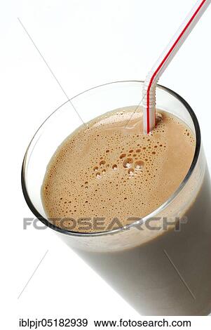 Stock Photo - Cocoa, glass of drinking chocolate with straw, cocoa drink, dairy products, chocolate. Fotosearch