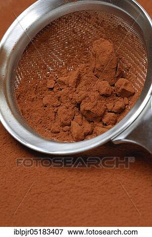 Cocoa powder in sieve ( Theobroma cacao) powder View Large Photo Image Stock Photo - Cocoa powder in sieve ( Theobroma cacao) powder. Fotosearch