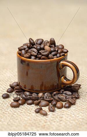 Stock Photography - Coffee beans in a cup. Fotosearch