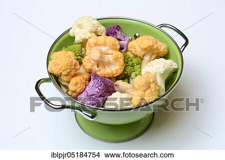 Picture - Coloured Cauliflower ( Braßica oleracea var. botrytis) in draining sieve ( Braßica oleracea, var. botrytis). Fotosearch