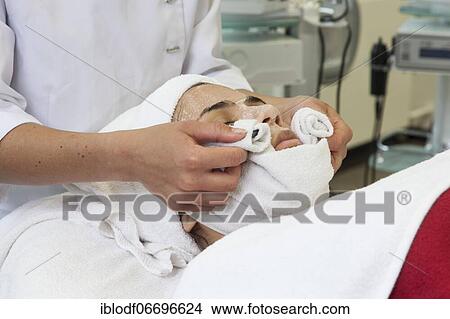 Picture - Compress for cleansing the face in practical lessons. Training as a beautician at the vocational school, Düsseldorf, North Rhine-Westphalia, Germany, Europe. Fotosearch