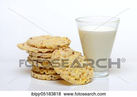 Stock Photo - Corn wafers and corn kernels, corn crackers, glass of milk. Fotosearch