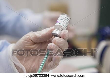 Covid-19 vaccination, vaccine from AstraZeneca, ampoule syringe being drawn up, Bergisches Land, North Rhine-Westphalia, Germany, Europe View Large Photo Image Picture - Covid-19 vaccination, vaccine from AstraZeneca, ampoule syringe being drawn up, Bergisches Land, North Rhine-Westphalia, Germany, Europe. Fotosearch