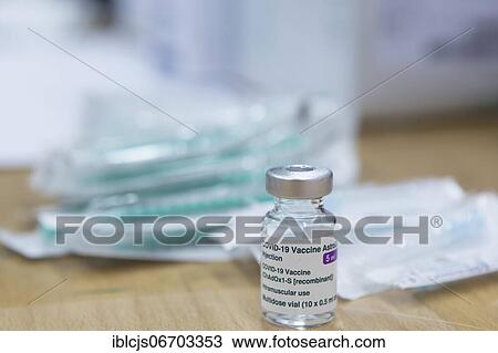 Covid-19 vaccination, vaccine from AstraZeneca, ampoule on table in front of empty syringes, Bergisches Land, North Rhine-Westphalia, Germany, Europe View Large Photo Image Stock Image - Covid-19 vaccination, vaccine from AstraZeneca, ampoule on table in front of empty syringes, Bergisches Land, North Rhine-Westphalia, Germany, Europe. Fotosearch