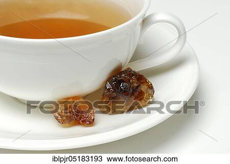 Cup of tea and brown rock candy, sweet, rock candy View Large Photo Image Stock Image - Cup of tea and brown rock candy, sweet, rock candy. Fotosearch