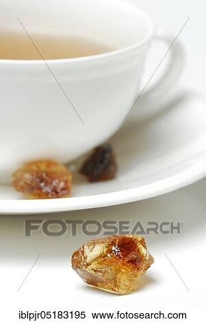 Cup of tea and brown rock candy, sweet, rock candy View Large Photo Image Stock Photography - Cup of tea and brown rock candy, sweet, rock candy. Fotosearch