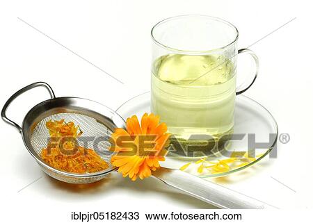 Stock Image - Cup of tea, Marigolds-tea, tea strainer. Fotosearch