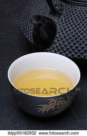 Stock Image - Cup with Sencha tea, green tea, green tea, tea bowl. Fotosearch