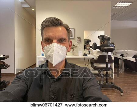 Customer with FFP2 mask at hairdresser, happy about haircut, hair salons reopen during lockdown, Corona crisis, Stuttgart, Baden-Württemberg, Germany, Europe View Large Photo Image Stock Photo - Customer with FFP2 mask at hairdresser, happy about haircut, hair salons reopen during lockdown, Corona crisis, Stuttgart, Baden-Württemberg, Germany, Europe. Fotosearch