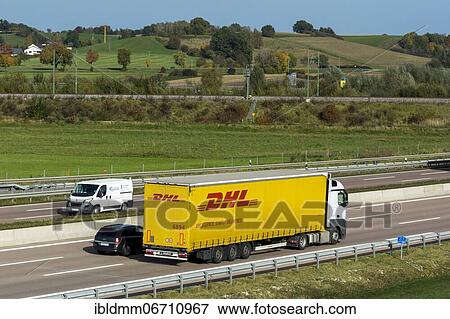 DHL truck driving on the A8 motorway near Jettingen, Bavaria, Germany, Europe View Large Photo Image Stock Photo - DHL truck driving on the A8 motorway near Jettingen, Bavaria, Germany, Europe. Fotosearch